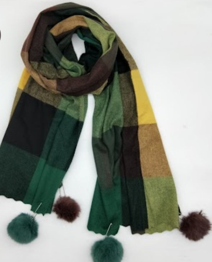 Checked winter scarves with pompoms